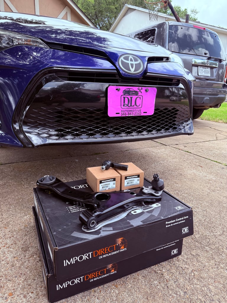 Mobile mechanic working on vehicle suspension